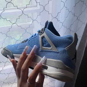 Jordan Retro 4s University blue, size 4Y worn couple times.